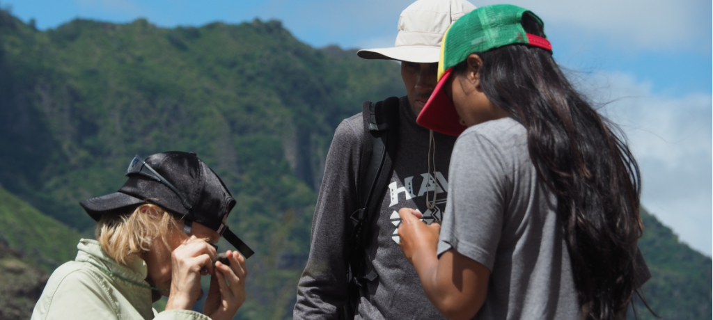 Professor with students in the field