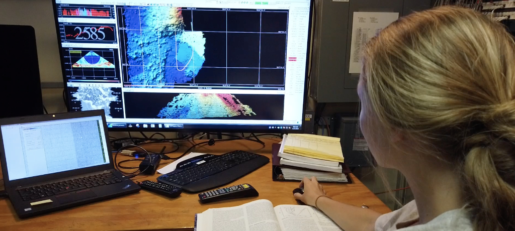 Student inspecting seafloor bathymetry data