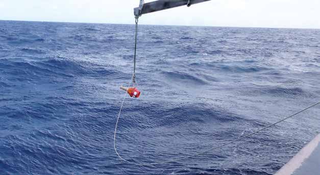 An Argo float suspended above water