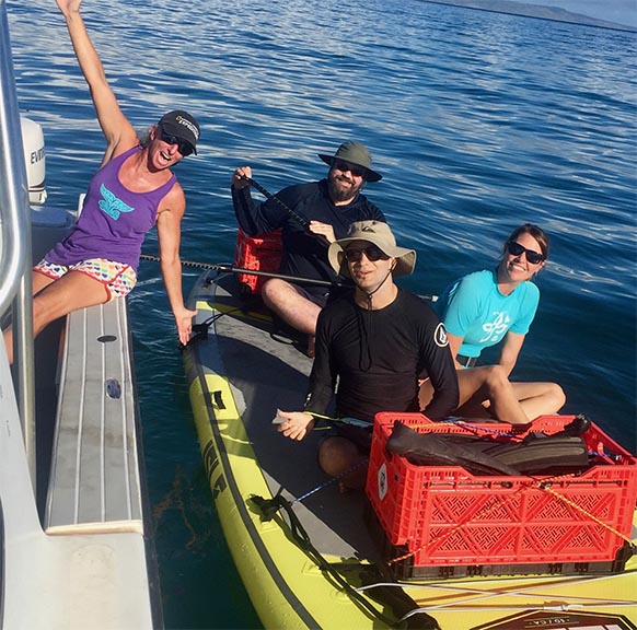 Researchers on a boat doing field work