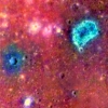This false-color composite image shows titanium basalts and a fresh impact crater (in blue) that remain exposed within the Ina structure on the moon, suggesting relatively recent volcanic activity.