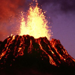 “View at dusk of the young Pu‘u ‘O‘o cinder-and-spatter cone, with fountain approximately 40 m high, during episode 5” by G.E. Ulrich, 6/29/83, GU6830A. courtesy of the U.S. Geological Survey