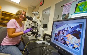 Photo of Katharine Robinson in lab.