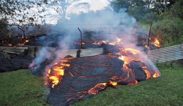 Photo of lava in Pahoa. Lava flow from Kilauea volcano, near the village of Pahoa, on 28 October 2014. In 2014, breakout lava flow from Kilauea threatened a housing subdivision, and destroyed at least one home, on Hawai'i's Island. Image courtesy of the USGS.