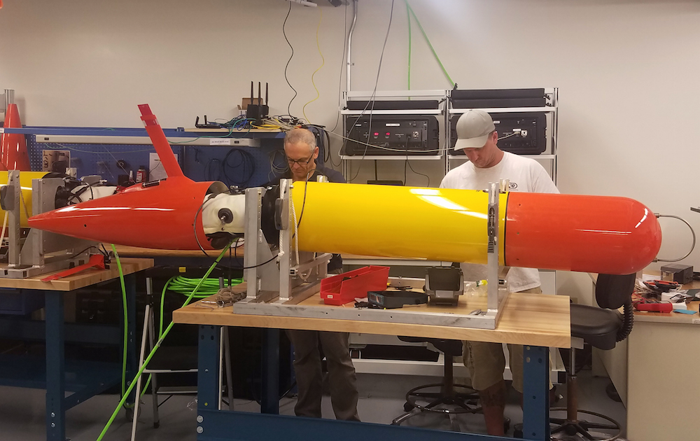 Brett Hobson from MBARI and Gabe Foreman from the University of Hawaii prepare a long-range AUV for field trials. Image: Chris Preston © 2018 MBARI
