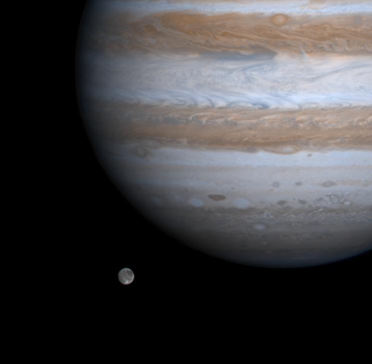 Ganymede alongside Jupiter, image from NASA's Cassini spacecraft. Credit: NASA/JPL/University of Arizona.
