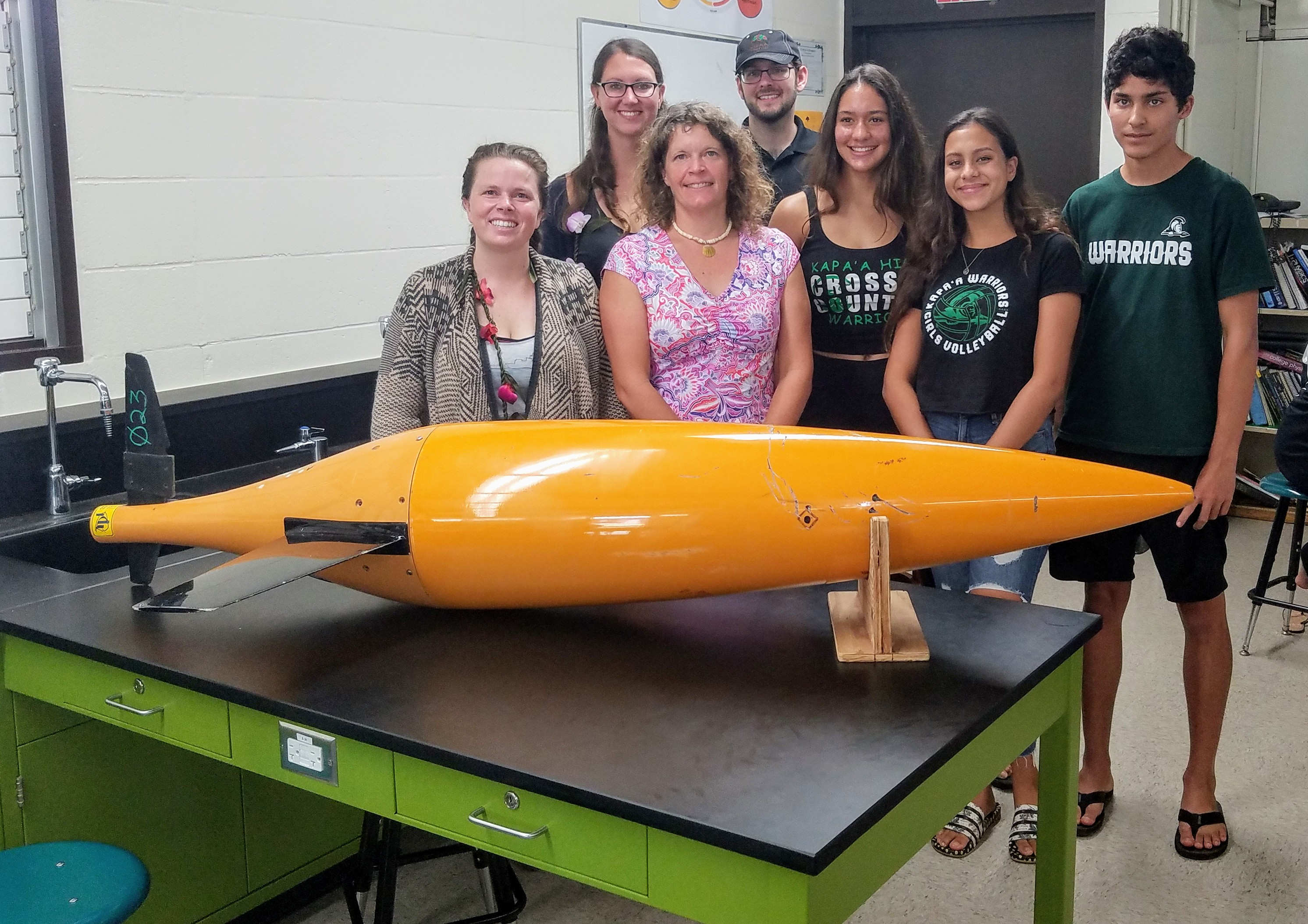 Kelly Pearson and Amanda Ziegler with students and faculty at Kapa'a High School. Credit: Nancy Borilez.