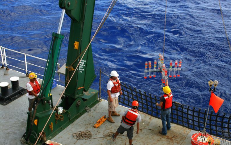 Hawaii Ocean Time-series researchers collect ocean particles that settle through the water column
