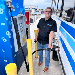 Mitch Ewan, HNEI hydrogen system program manager, at making “first fill” on new hydrogen bus