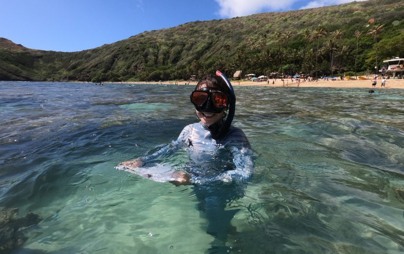Shannon Murphy conducting at research with snorkel and mask at Hanauma Bay for her senior thesis