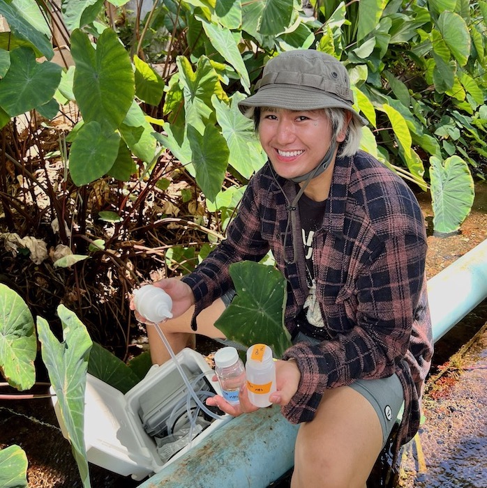 Brandon Dela Cruz collecting water samples.