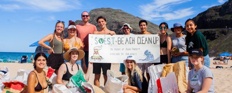 SOEST Club members participating in a beach cleanup