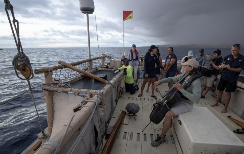 Yo-Yo Ma playing cello on the Hokule'a.