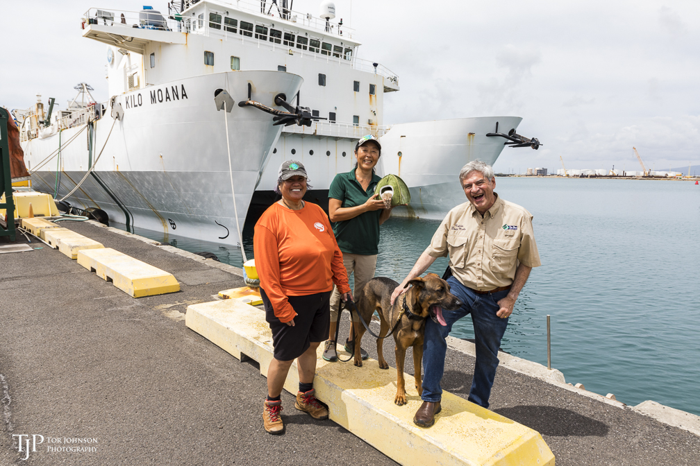 Dog handlers Lisa and Kyoko, rat Junior, dog Guinness, and Captain David Martin at the UH Marine Center.