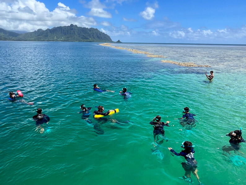 Students participating in the Research Experiences in Marine Science at the Hawaiʻi Institute of Marine Biology snorkel in Kaneohe Bay.
