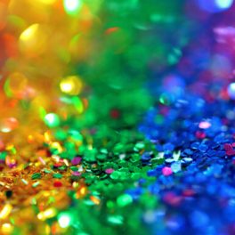 Rainbow colored confetti shimmering in the light