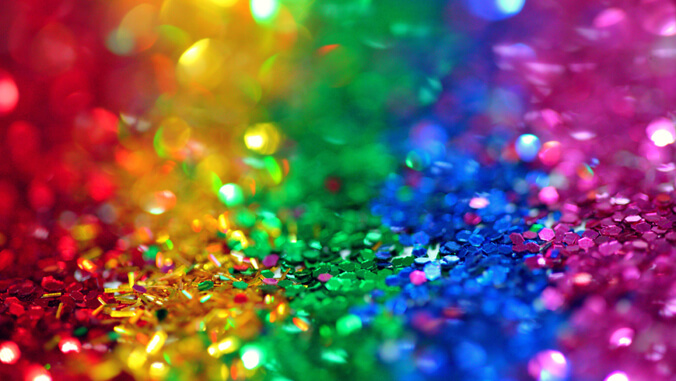 Rainbow colored confetti shimmering in the light