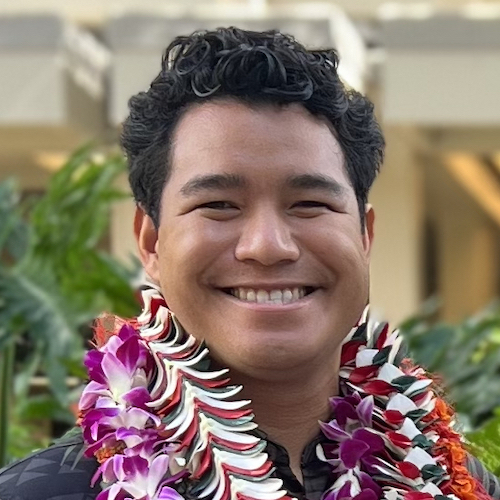 Keanu Rochette-Yu Tsuen wearing lei